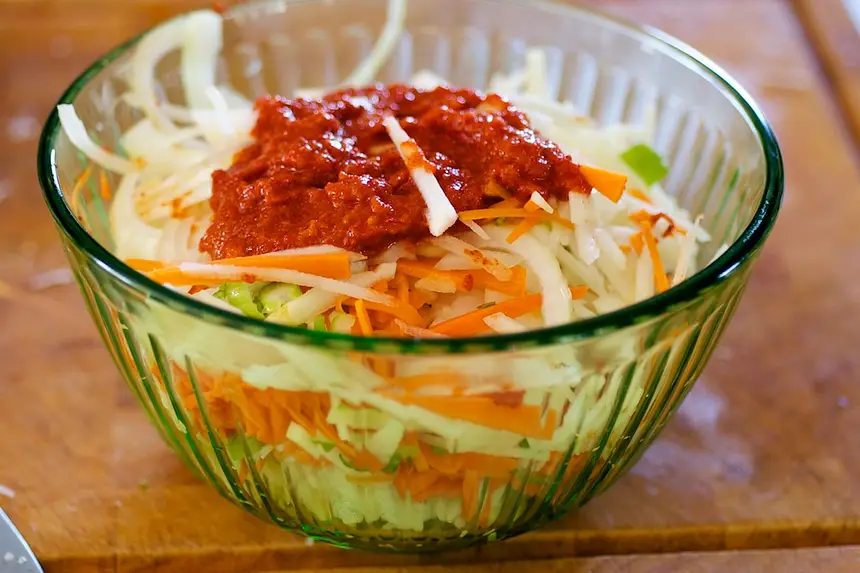 In a large mixing bowl,
