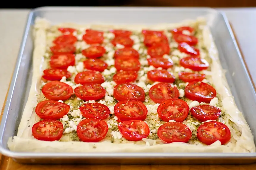 Place tomato slices,