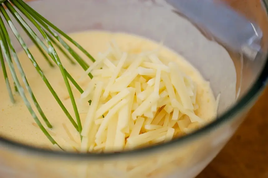 Mix ingredients until blended. Add grated cheese.