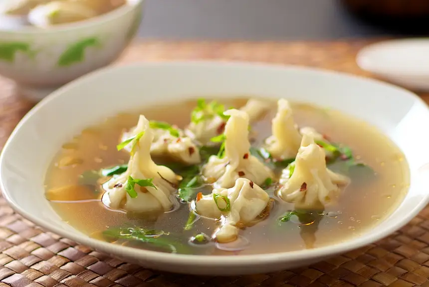 Heat the chicken stock, salt and sesame to boiling.