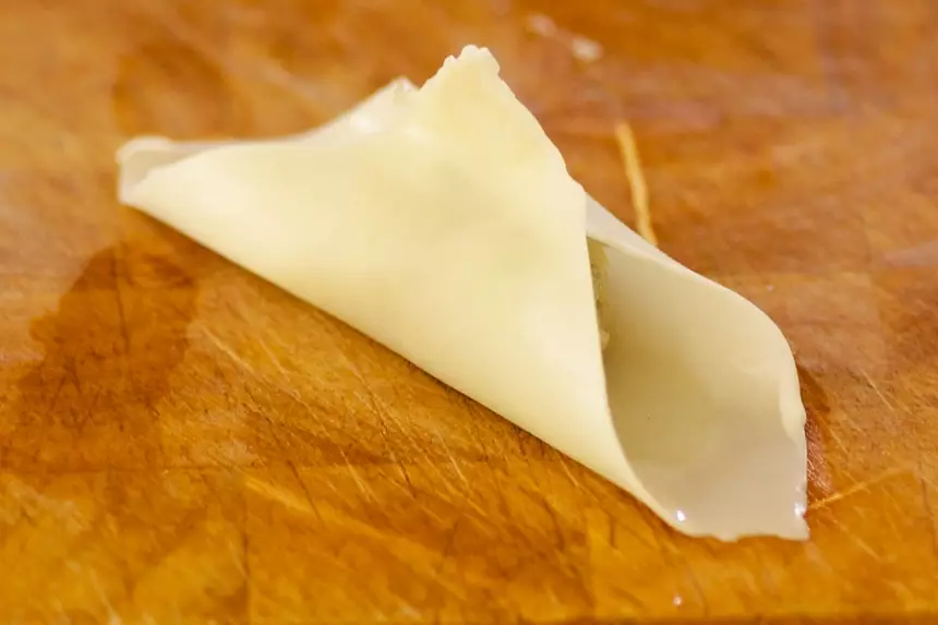 Gather the edges of the skin together, around the filling.