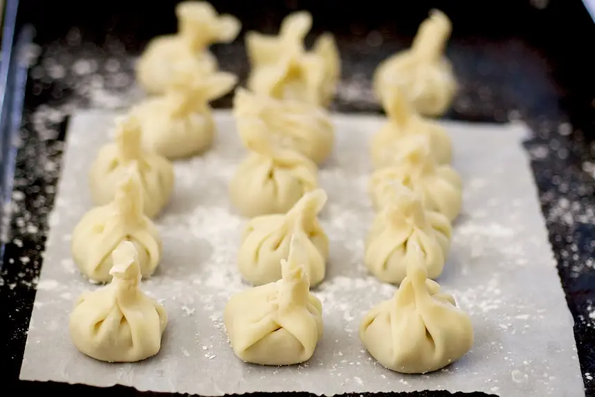 Place the finished dumplings on a tray