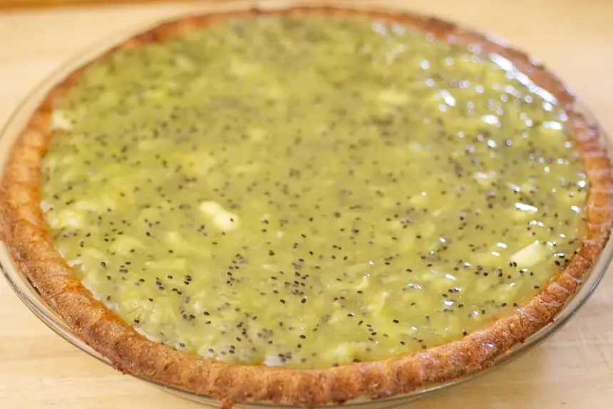 Pour mashed kiwi mixture over all. Smooth edges.  
