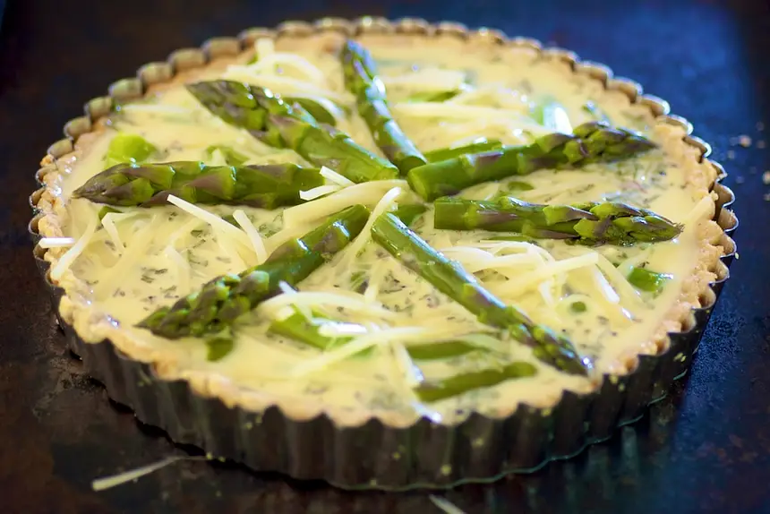 Arrange reserved asparagus tips in a decorative pattern on top.  