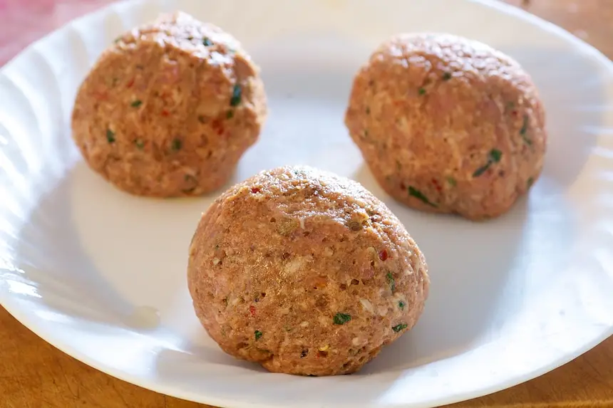 Repeat until all the eggs are well covered by the meat mixture.