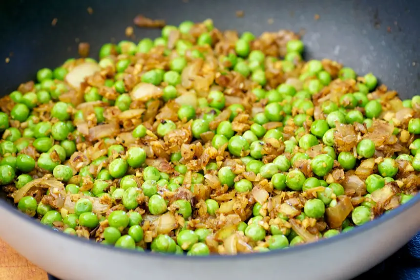 Stir in peas,