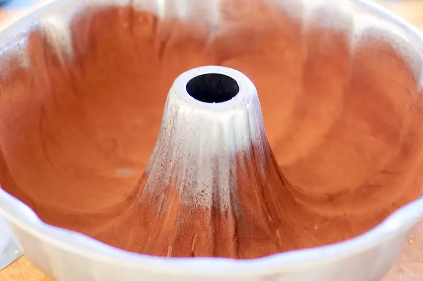 Well butter and flour a bundt cake pan. 