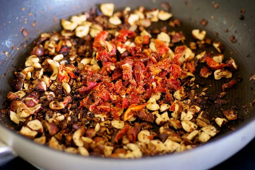 Add the sun-dried tomatoes, and cook for 1 minute.