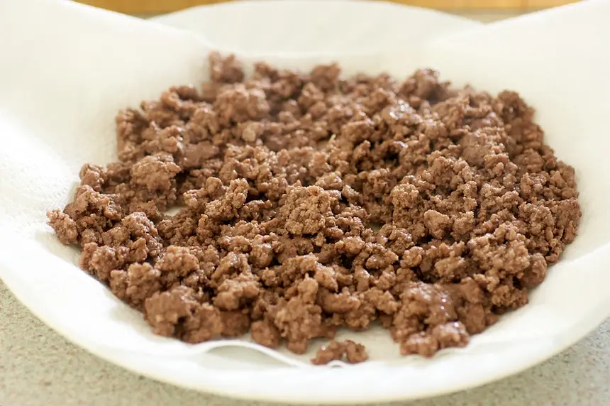 Remove to a plate lined with paper toweling to drain.