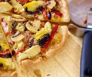 Basil Pesto, Artichoke Hearts, Sun-dried Tomato & Roasted Bell Pepper Pizza