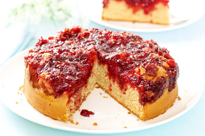 Remove the pan sides and cut the cake into wedges.  