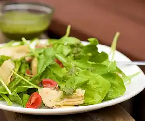 Arugula, Artichoke & Cherry Tomato  Salad with Pesto Vinaigrette