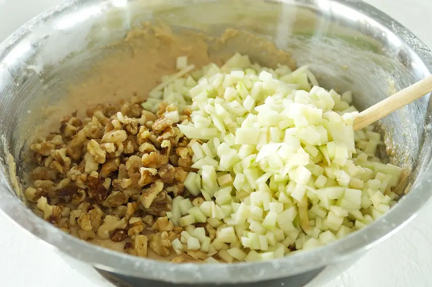 Fold in walnuts and apples.