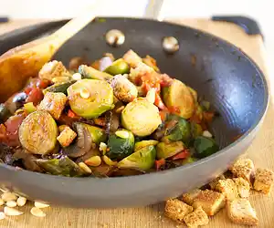 Tomato Braised Brussel Sprouts with Pine Nuts & Croutons