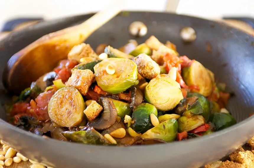 Tomato Braised Brussel Sprouts with Pine Nuts & Croutons