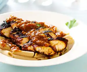 Blackened Chicken Strips on Pasta with Cajun Sauce