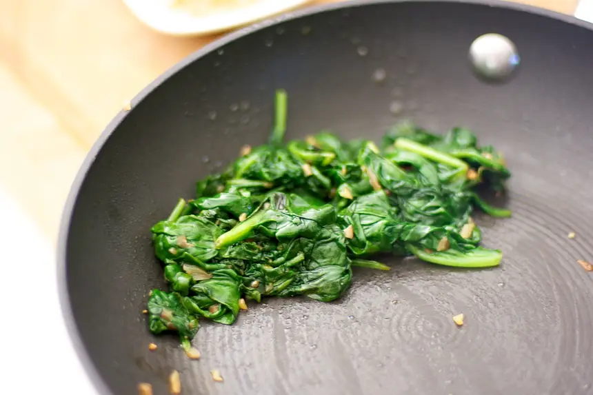 Transfer the spinach into a colander,
