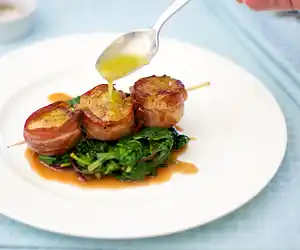 Prosciutto Wrapped Scallops with Citrus Baby Spinach
