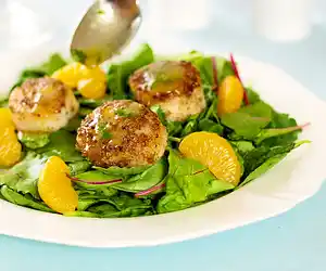 Coriander Spiced Scallops with Orange Ginger Dressing & Greens