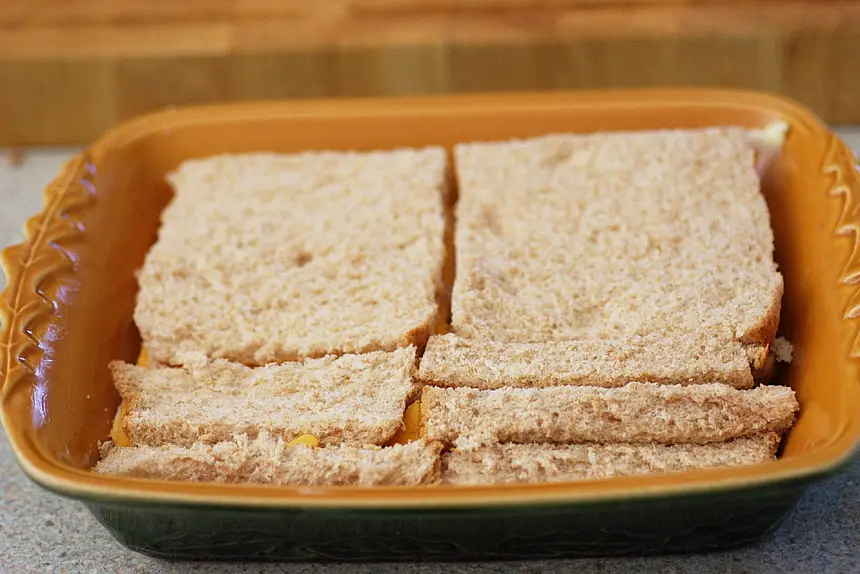 Final layer of bread added to the casserole
