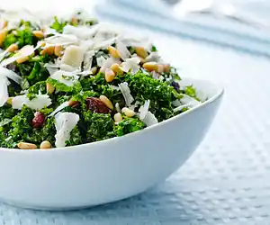Kale Salad with Pinenuts, Currants & Parmesan