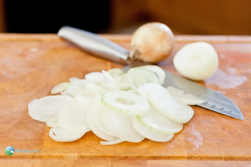 Sliced onions on a cutting board