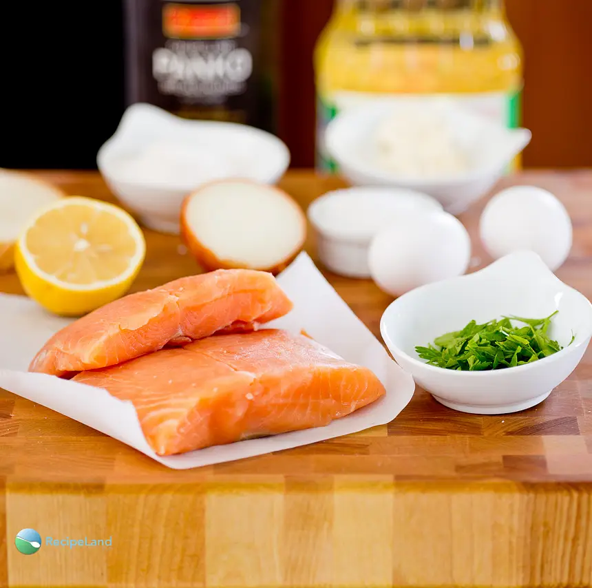 Ingredients for salmon cakes on a cutting board