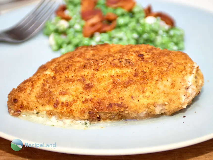 Stuffed chicken breasts with oozy gooey cream cheese and basil pesto. Common ingredients result in juicy chicken packed with flavor. Rich and low-fat rarely go together but this recipe delivers both!