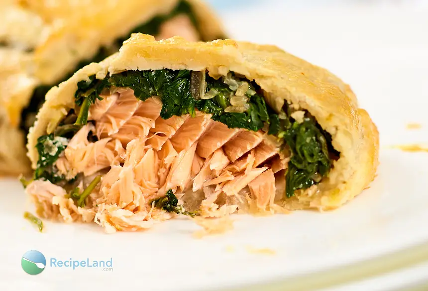 Juicy <a href="/how-to/salmon-temperature" title="Internal Salmon Temperature">salmon</a> with spinach stuffed inside of flaky puff pastry.