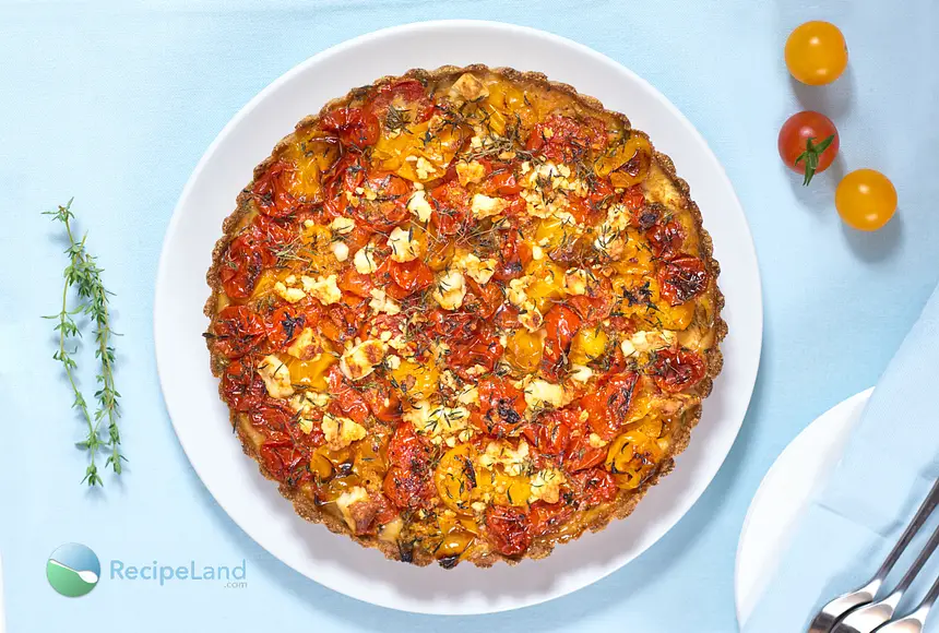 This delicious savory tart is made with roasted cherry tomatoes, feta cheese, and fresh herbs. It’s cheesy, sweet, juicy and very tasty. You can have it as an appetizer or a main dish!
