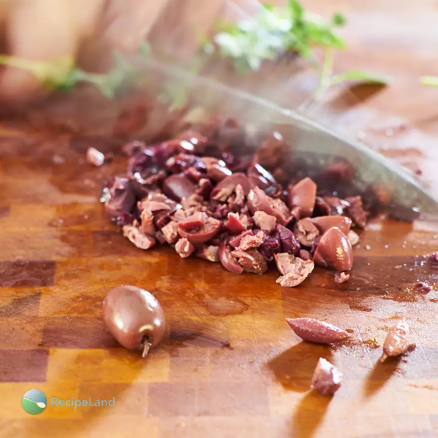 Chopping pitted black olives
