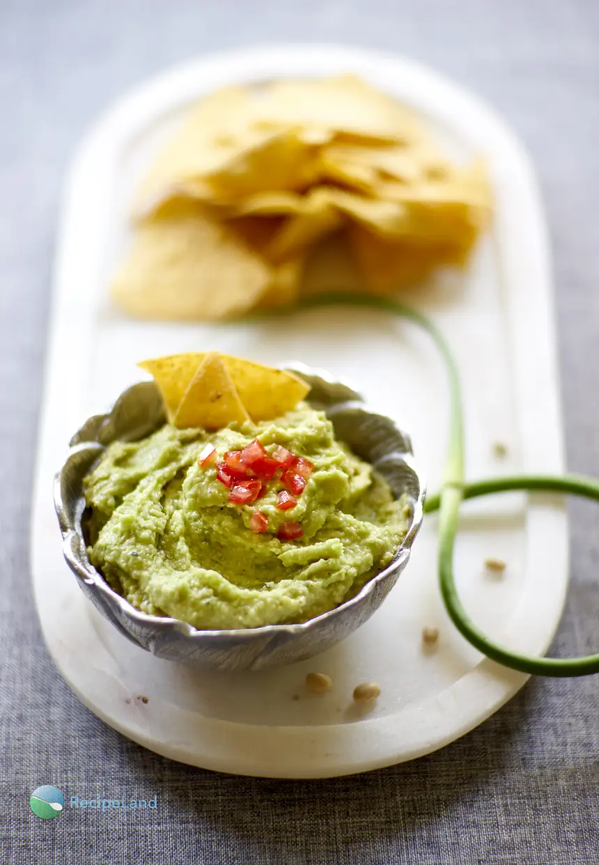 Garlic scapes lift this bean dip into a seasonal, delicious and healthy beginning of summer dip.A fluffy and billowing fresh green colored dip with a velvety texture and mildly assertive green garlic warmth to wrap around any crudites of your choosing.