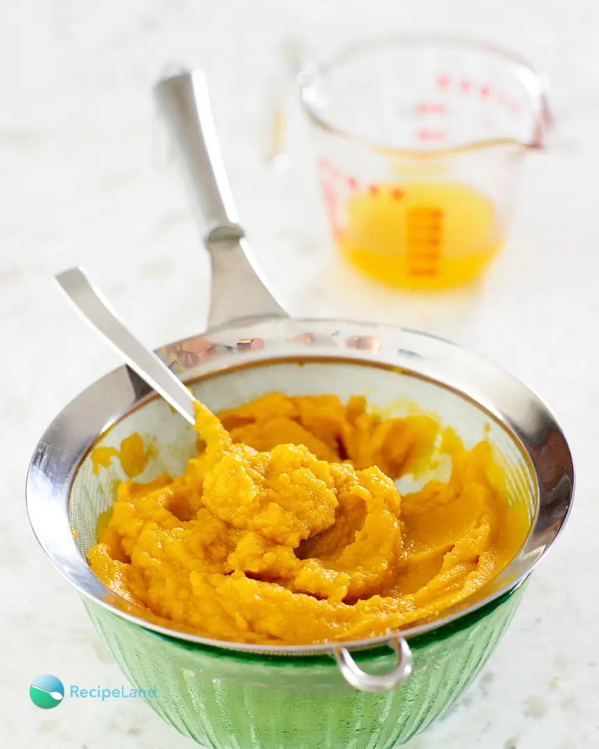 Draining fresh homemade pumkin puree in a sieve