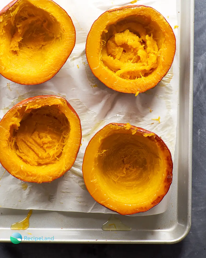 Baked sugar pumpkin halves, cut side up for final baking to reduce moisture content. Homemade pumpkin puree too watery? Not when using this technique.