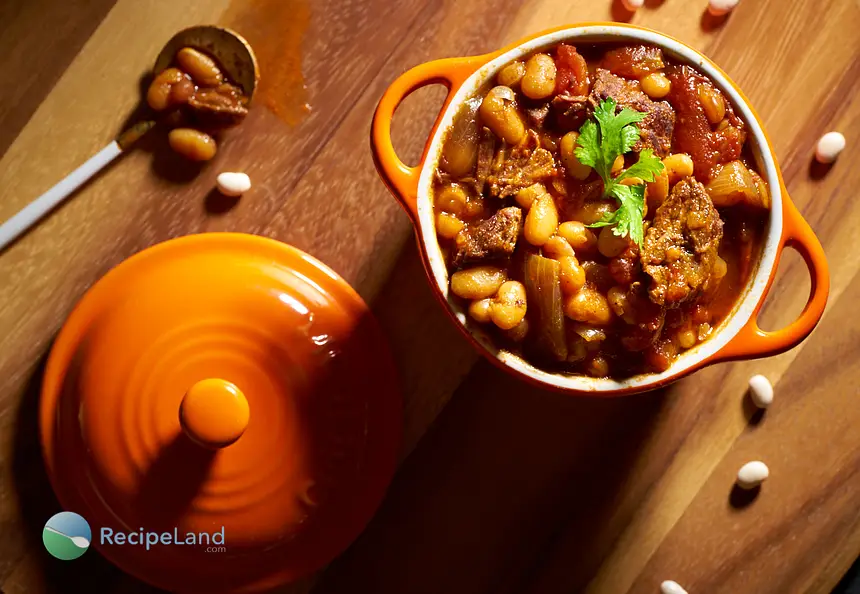 Beef chili with navy beans, one of our many easy chili recipes. Perfect for simmering on the stovetop or use your crock-pot for a slow-cooker chili recipe.