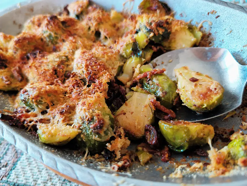 Gratin of Brussels sprouts with lardons, cream & almonds