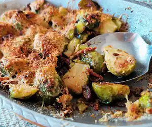 Gratin of Brussels sprouts with lardons, cream & almonds