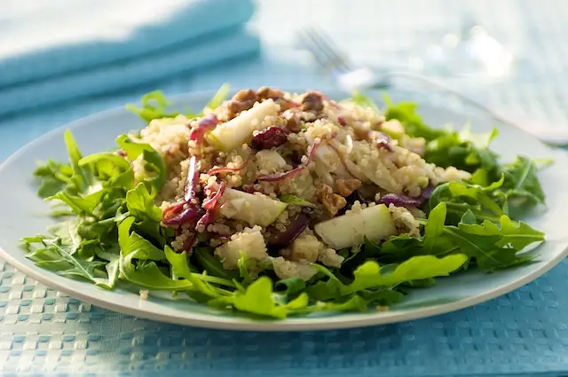 Quinoa & Arugula Salad with Pears, Walnuts, Dried Fruits, & Jack Cheese
