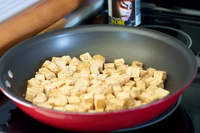 Place the marinated tofu in the pan