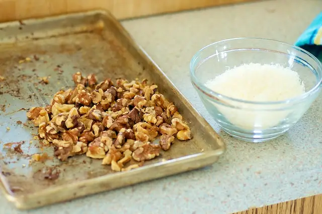 Prepare the walnuts and parmesan cheese