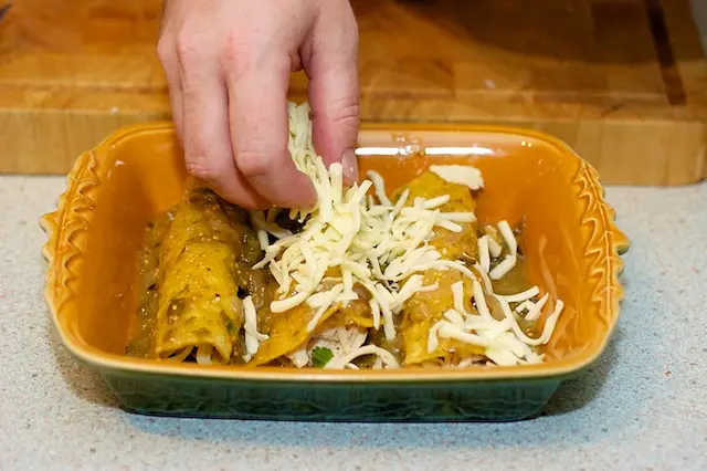 Sprinkle the cheese evenly over the enchiladas
