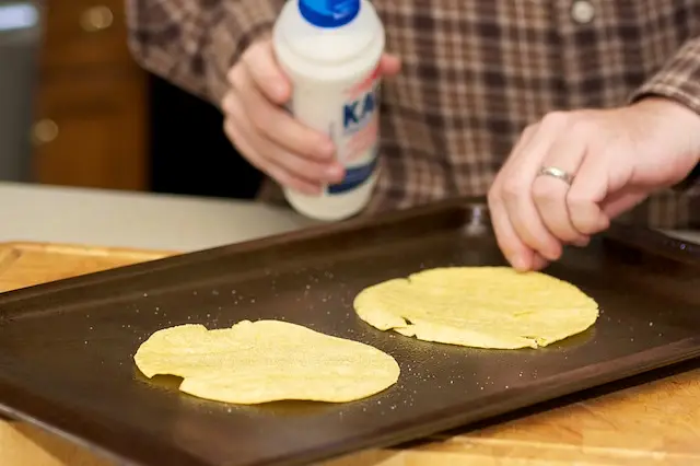 Season the corn tortillas and pop them in the oven