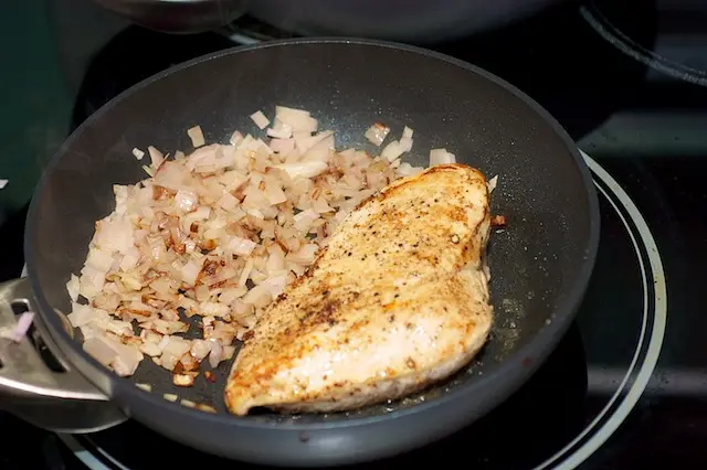 The chicken and onions browning nicely