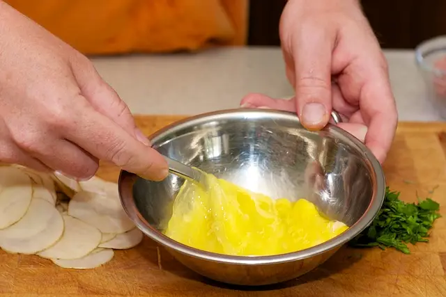 Whisk eggs with a fork