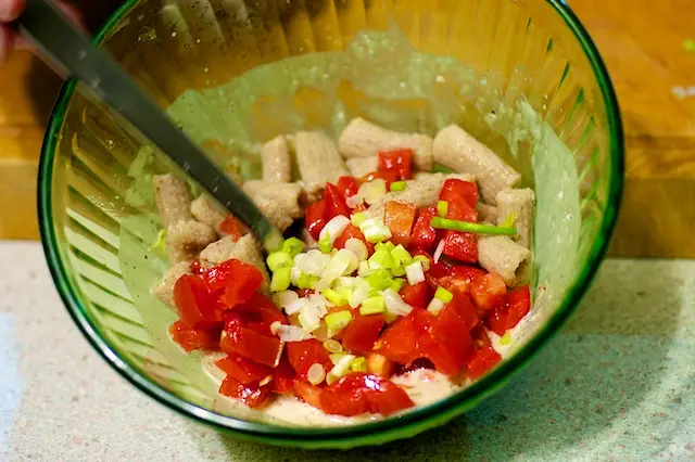 Add the tomatoes and cooked pasta