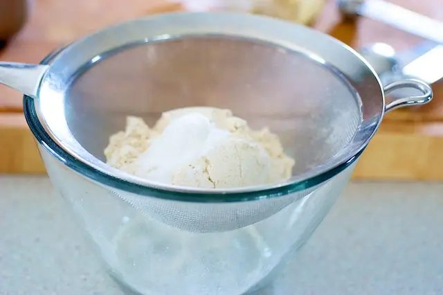 Add the flour, baking powder and salt in a fine sieve over a large bowl...