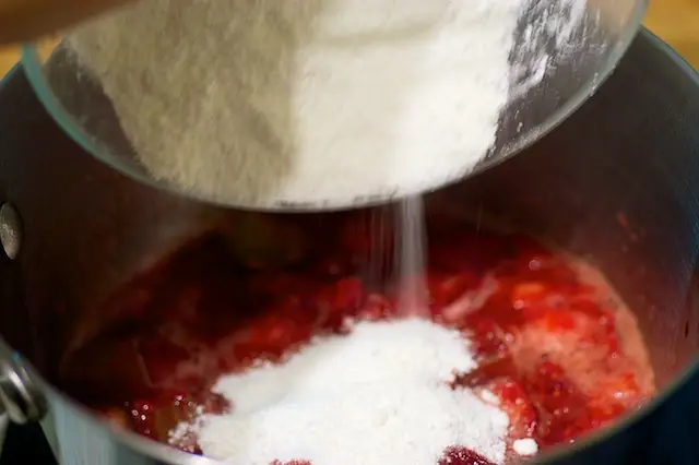 After 5 minutes, add the sugar mixture into the pot...