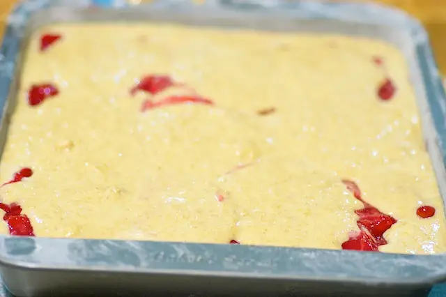 drop remaining batter by tablespoonfuls over filling.