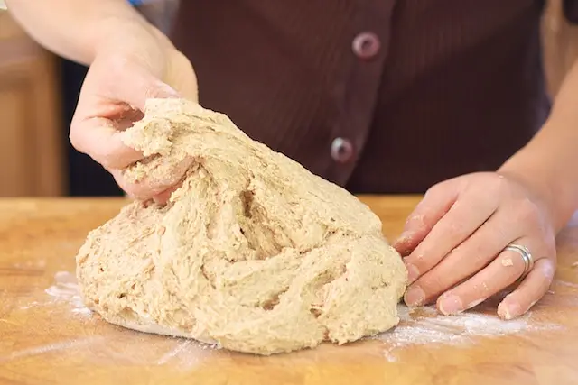 Here we have the sticky dough turned out onto the lightly floured cutting board...