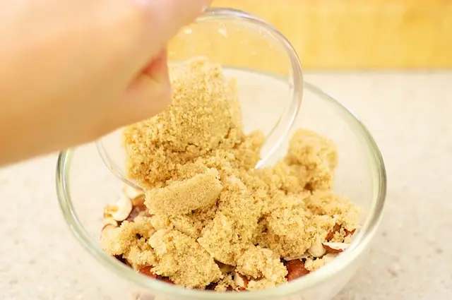 Add the chopped hazelnuts in a small or medium bowl...